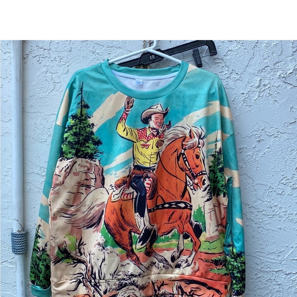 Roy rogers fans. Vibrant Turquoise Long Sleeve Tee with Cowboy Graphic Print